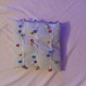 Small pillow with rainbow cotton ball